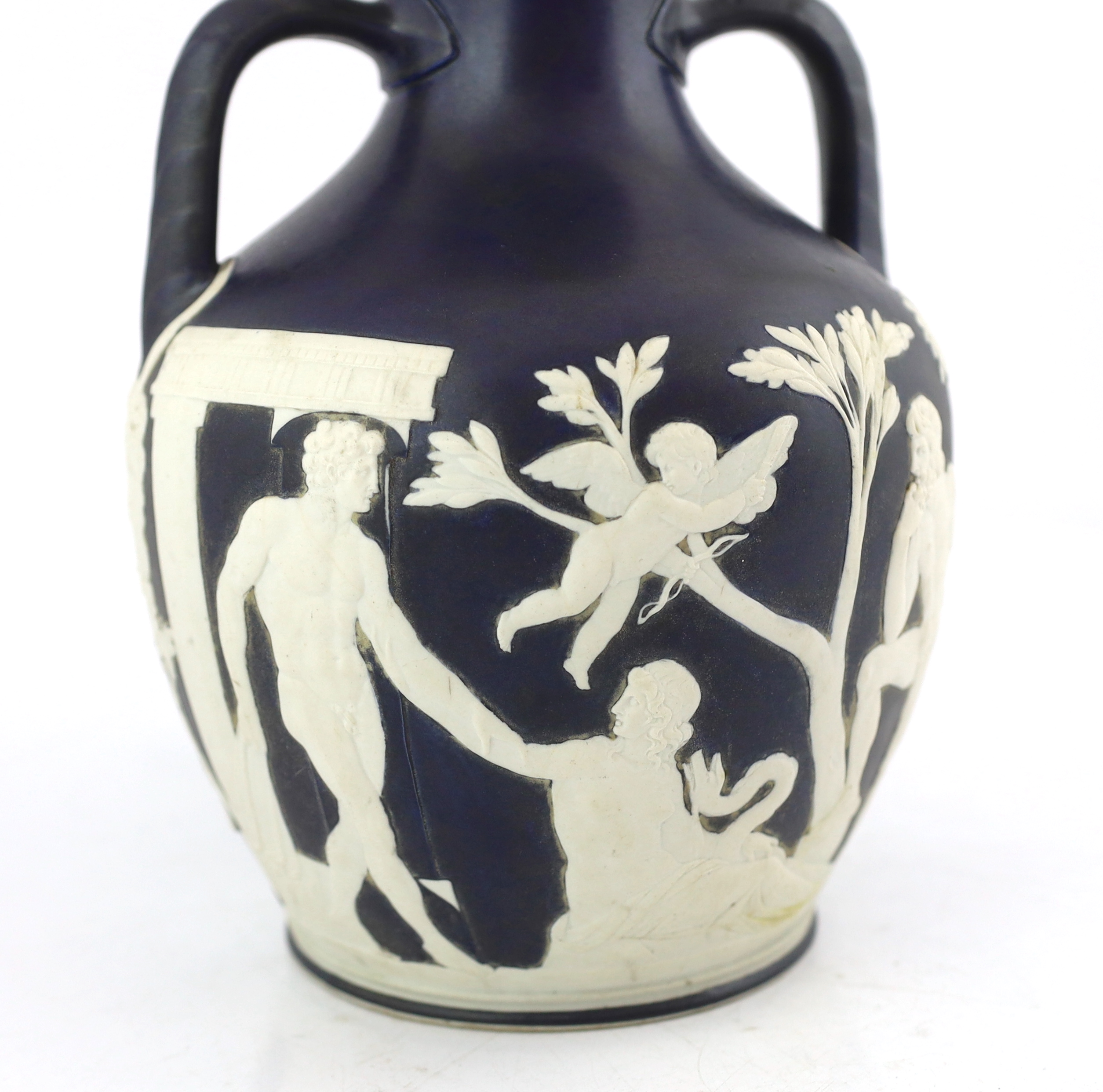 A Wedgwood dark blue glazed and white sprigged replica of the Portland vase, late 19th century